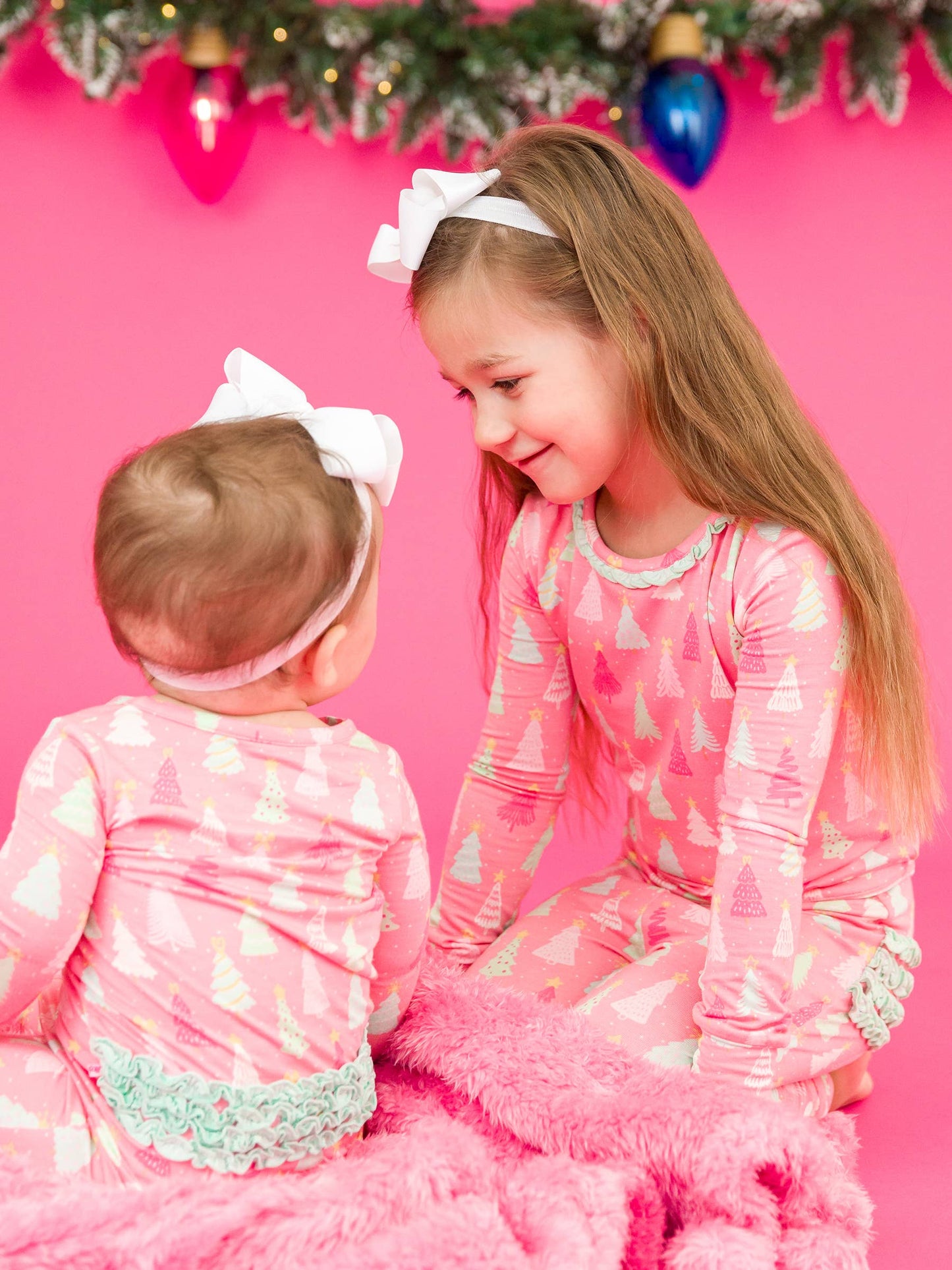 RuffleButts Merry Pink Pines Footed Ruffle One Piece Pajama
