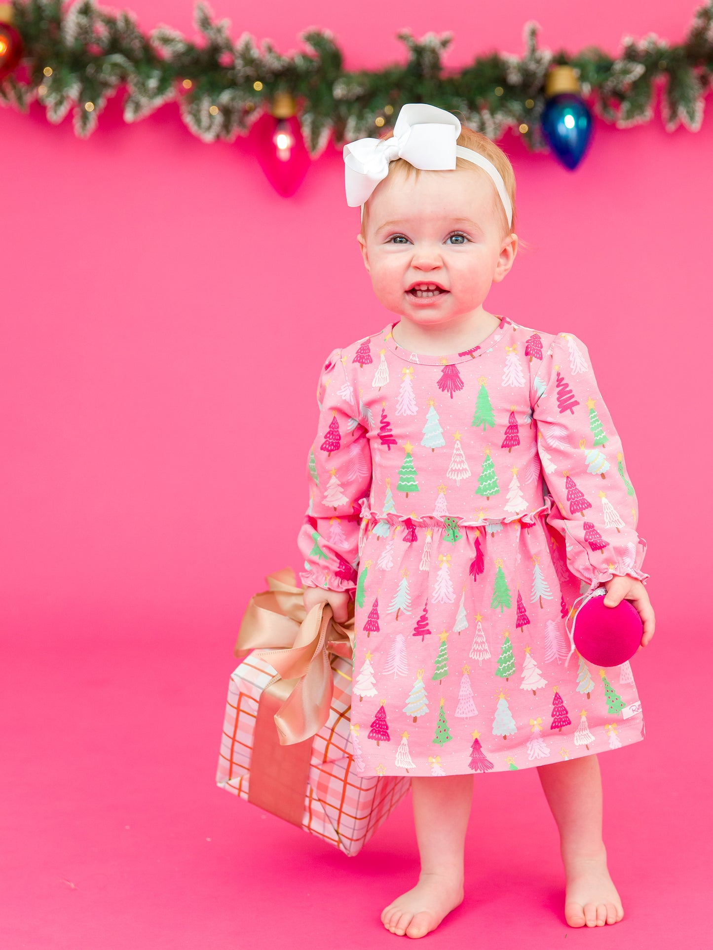 RuffleButts Merry Pink Pines Skirted Romper